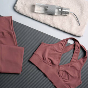 Flat lay composition with yoga equipment on grey background